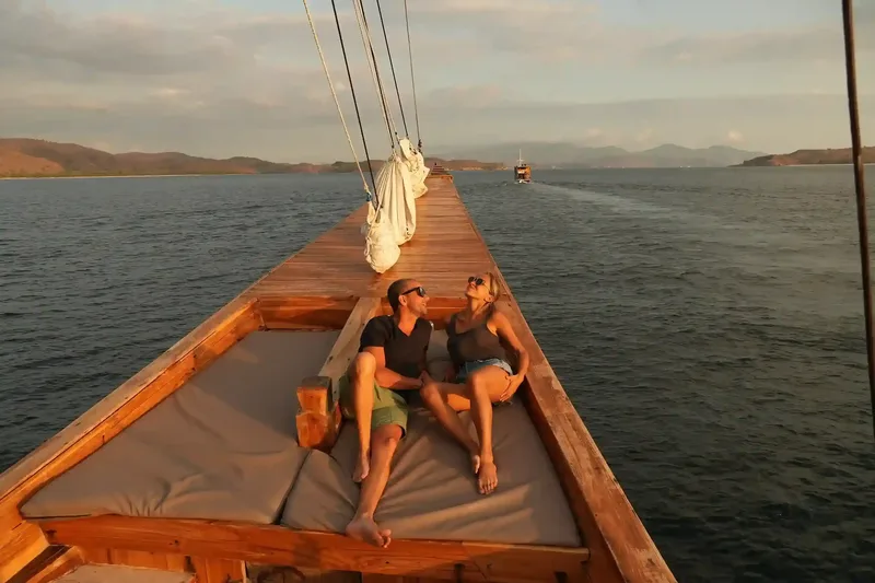 Sunbathing on the deck of a liveaboard in Komodo National Park