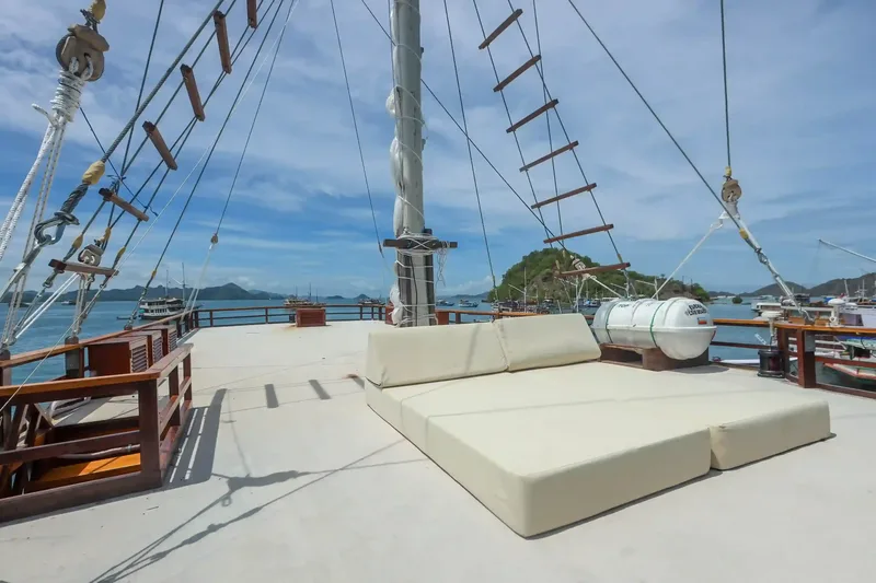 A daybed on the foredeck of a chartered phinisi