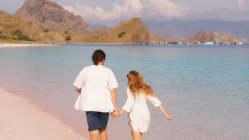 Walking the pink sand shoreline at Pink Beach, Komodo National Park