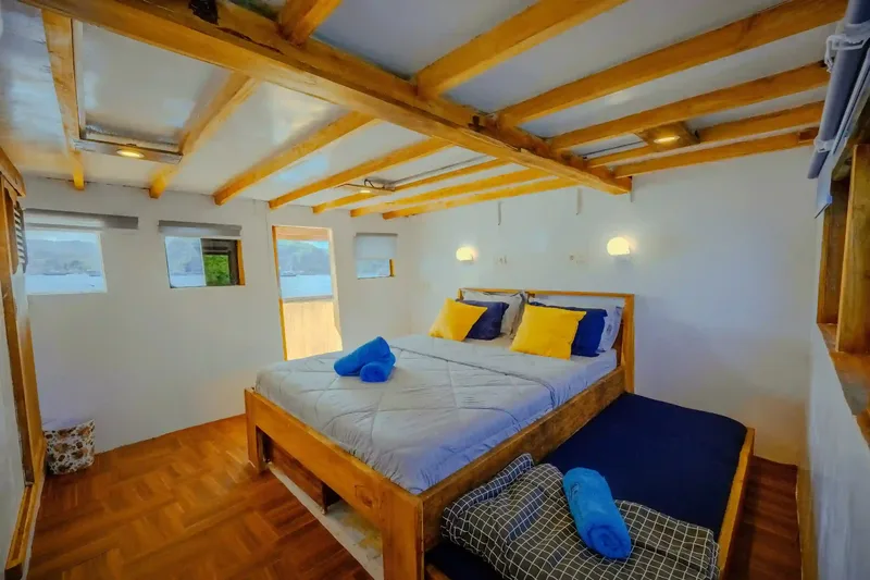 A timber cabin aboard a privately chartered phinisi
