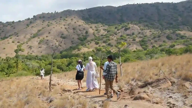 Walkers on the trekking track across Rinca Island