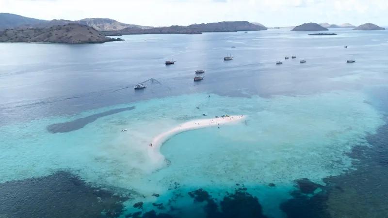 Taka Makassar from the air, boats anchored off the sandbar