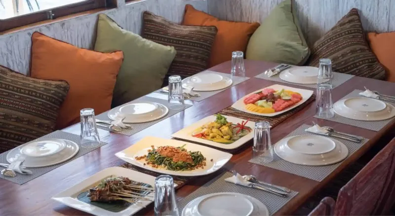 The indoor dining area of a Komodo liveaboard